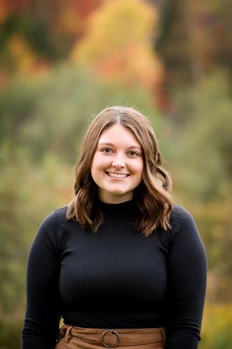 Student presents bus safety research to Legislative Assembly